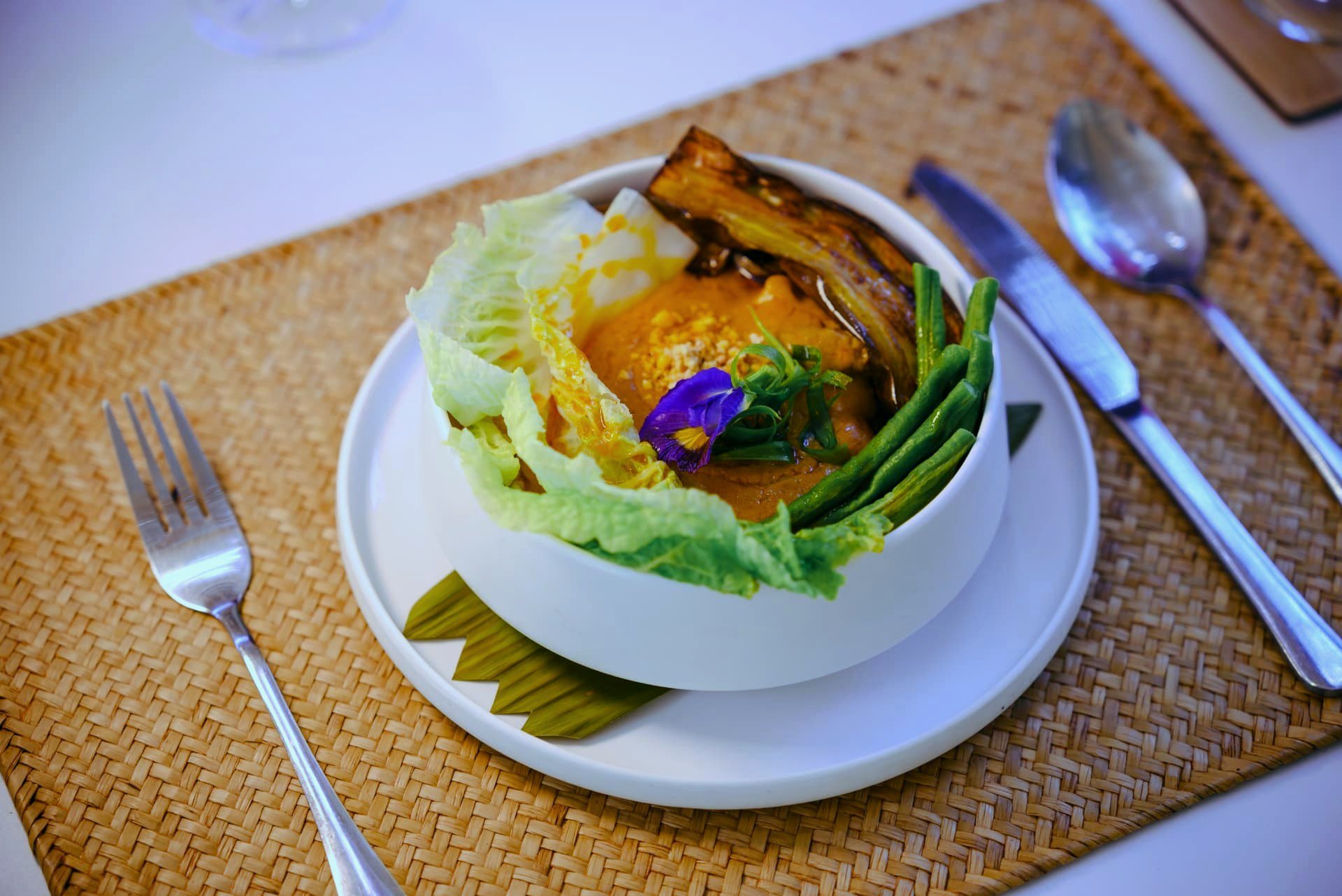 Kare-kare bowl with grilled eggplant and green beans