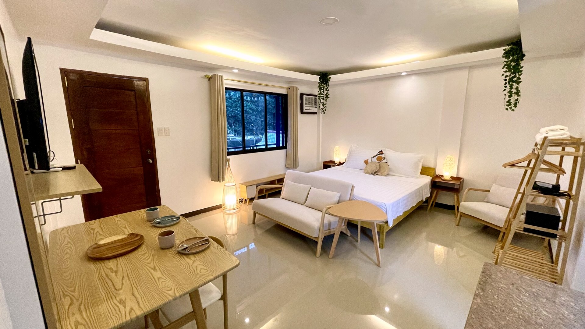 Open-plan living and dining space with ceiling fan