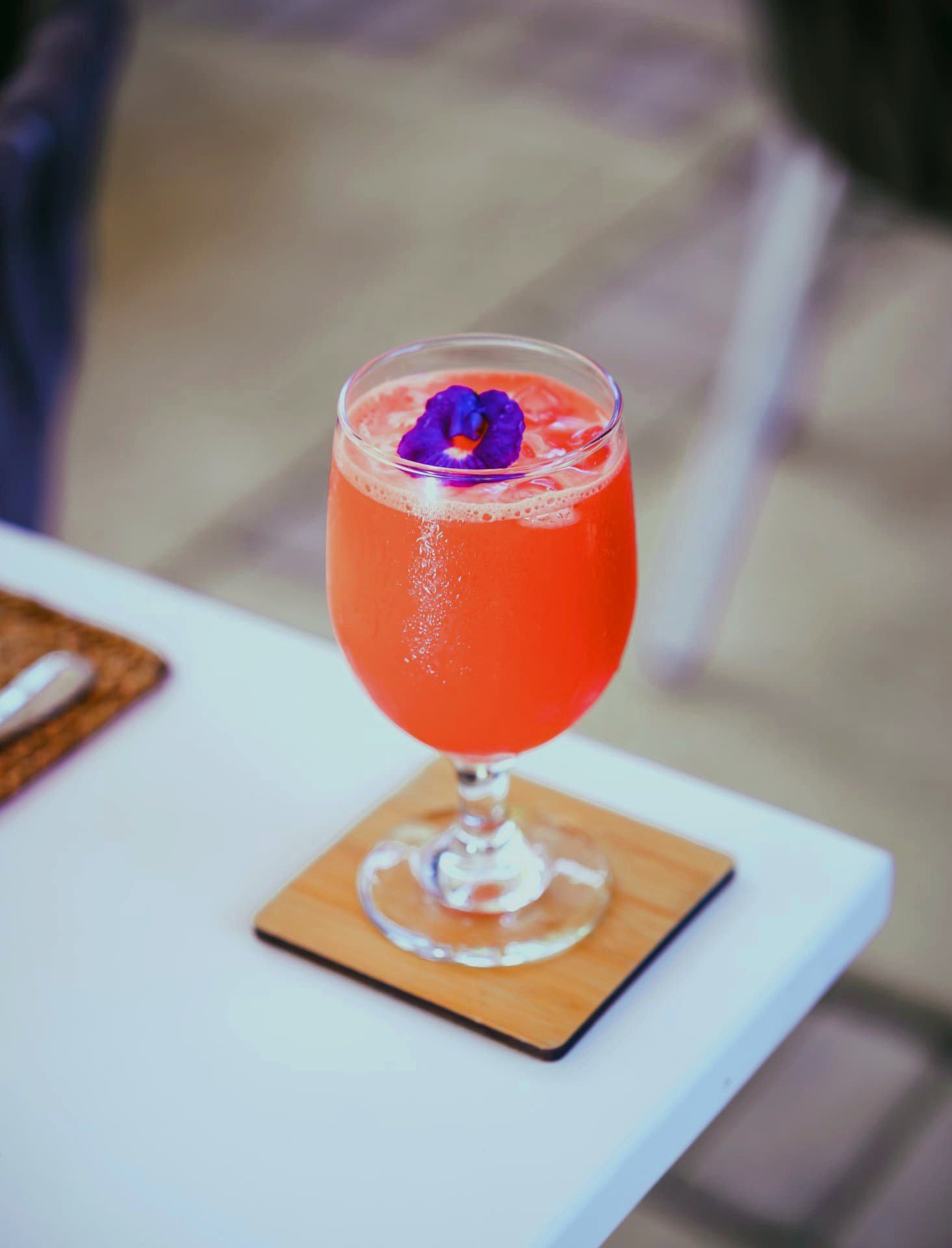 Watermelon cooler garnished with a butterfly pea flower