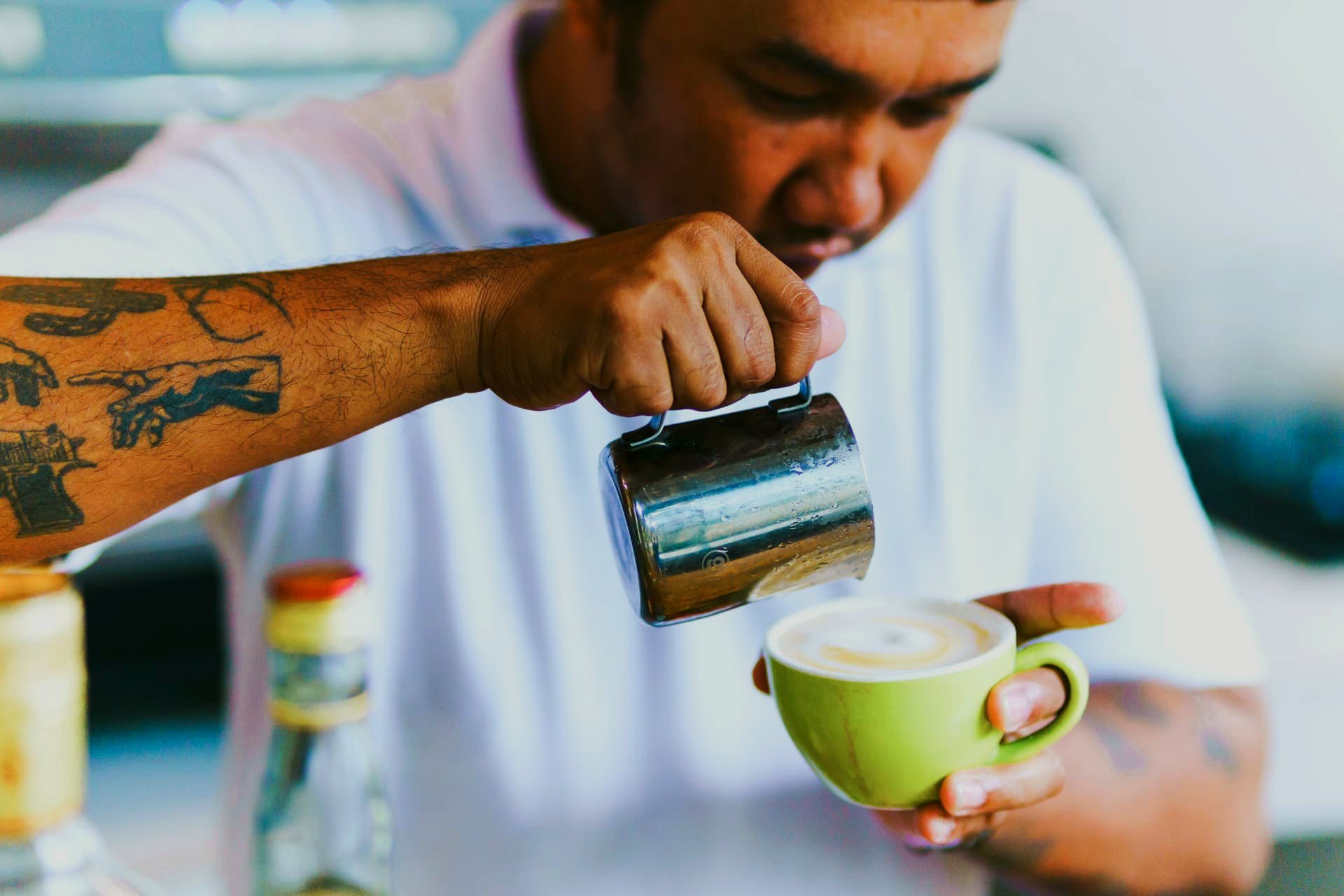 Barista pouring latte art at Namal Resort