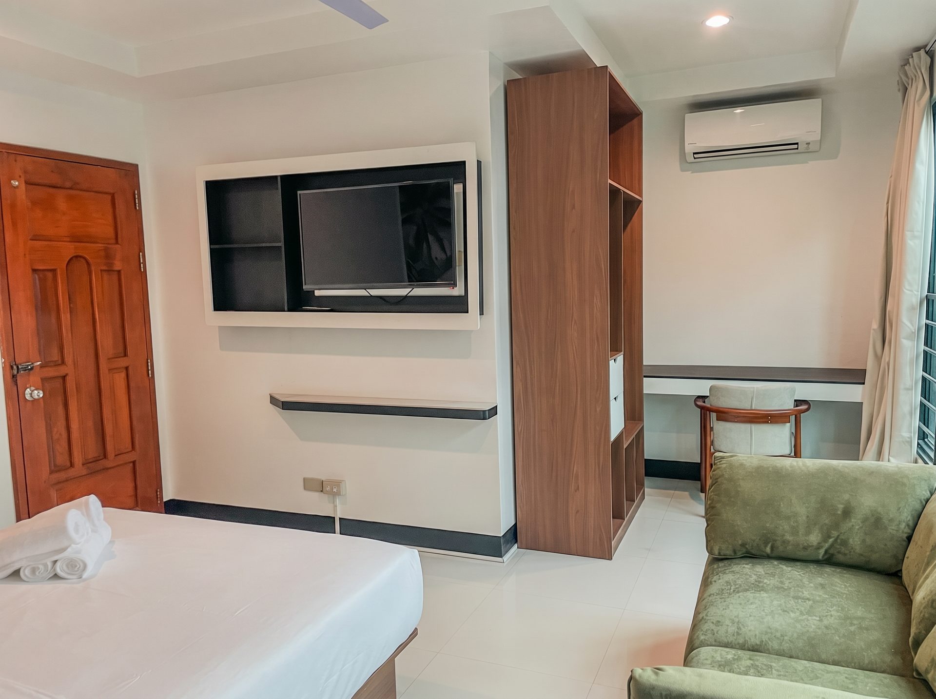 Work desk, TV and lounge seating in a room at The Town